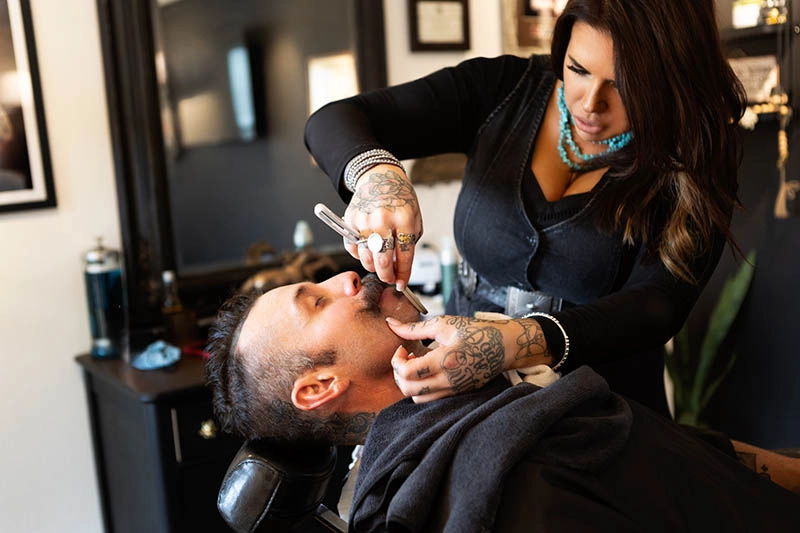 blanco-tx-barber-gallery7 Picture of Aimee doing hot lather shave on client
